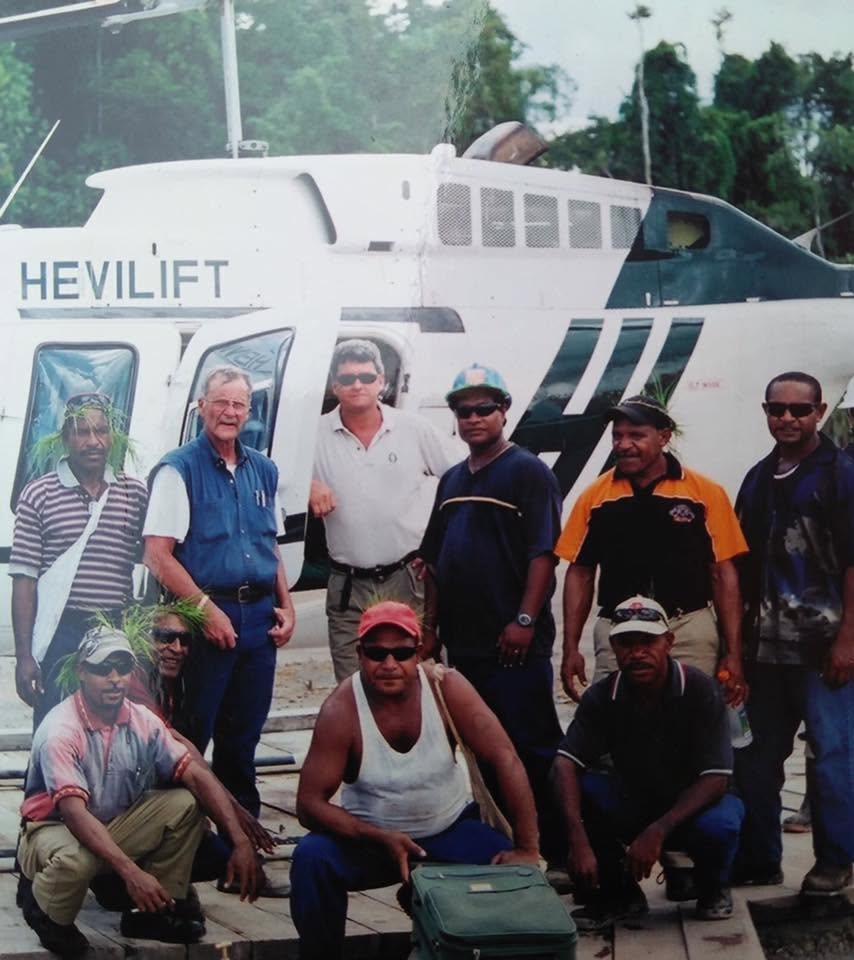 Phil_Mulacek_InterOil_Helicopter - Phil Mulacek Phil Mulacek and some of the team near the Hevilift Jet Ranger. Gulf Province, Papua New Guinea